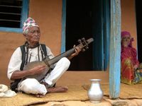 Mohan Gandharba, traditional musician and shaman at his house with his wife