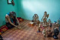 Tour participant trying out making some local crafts