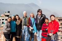 Tour group in a village making woodcarver friends. 