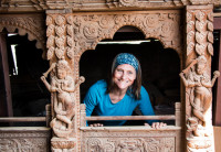 Tour member in an in progress Newari window