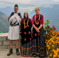 Trying on some local Gurung clothing on trek